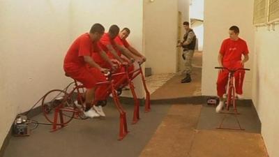 Brazil prisoners pedalling on the exercise bikes