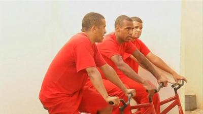 Brazil prisoners pedalling on the exercise bikes