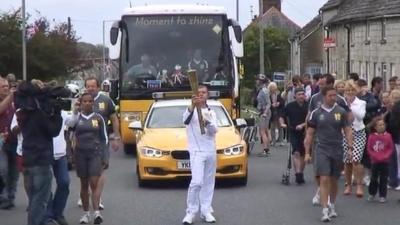 Benjamin Ridd carrying the torch