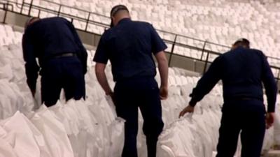 Security guards search stadium