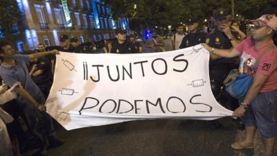 Protesters hold banner 'Together we can'