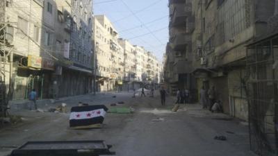 A Syrian opposition flag is seen at al-Tadamun area in Damascus