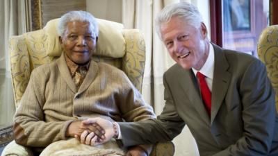 Former US President, Bill Clinton (R) pays a visit to former South African President Nelson Mandela