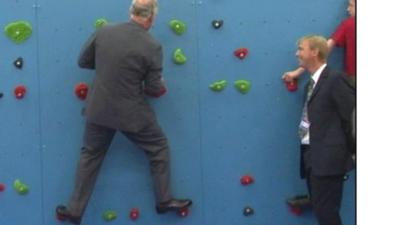 Prince Charles on a climbing wall