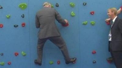 Prince Charles on a climbing wall