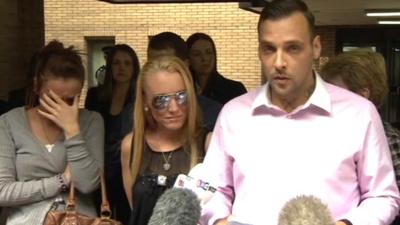 Ian Tomlinson's family outside court