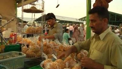 Shopkeeper setting up his shop