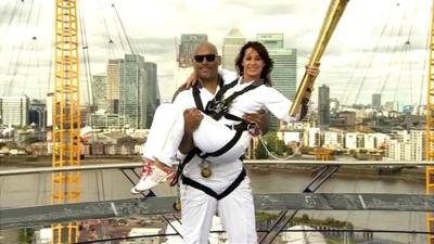 John Amaechi and Nadia Comaneci on North Greenwich Arena dome