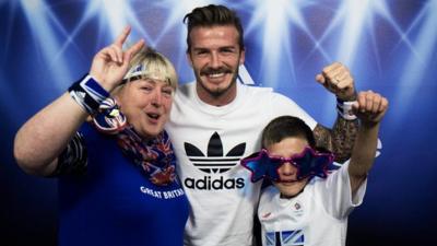 Beckham poses with Elaine and Christian