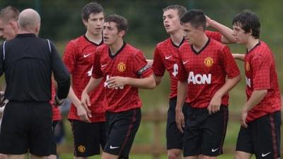 Man Utd players celebrate scoring against Revo Express