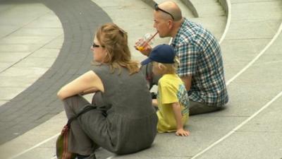 Family relaxing in the sunshine