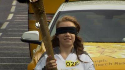 Mia Rathband carrying the Olympic torch