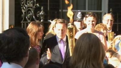 David Cameron and Olympic torch