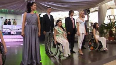Disabled models on a podium