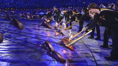 Seven young athletes light the Olympic caldron