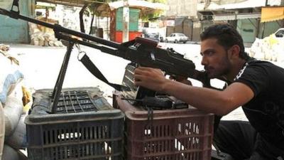 Free Syrian Army member takes position in a district of Aleppo, Syria