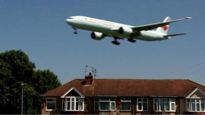 Plane flying over Myrtle Avenue near Heathrow