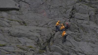 Mountain climbers on a rockface