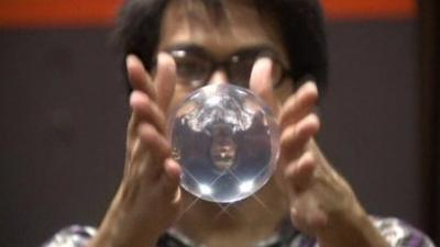 Man juggling an acrylic ball in the Philippines