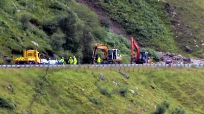 Engineers assess a landslip on the A83