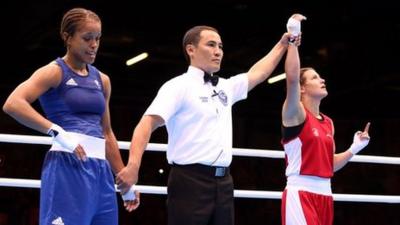 Katie Taylor celebrates defeating Natasha Jonas