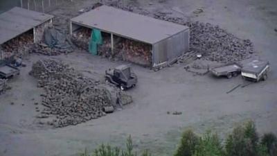 Ash from New Zealand's Mount Tongariro covers farm buildings and equipment