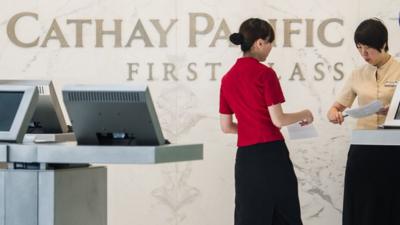 Cathay Pacific employees at the airport in Hong Kong