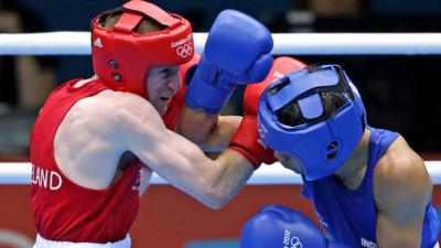 Paddy Barnes and Devandro Singh Laishram exhange punches