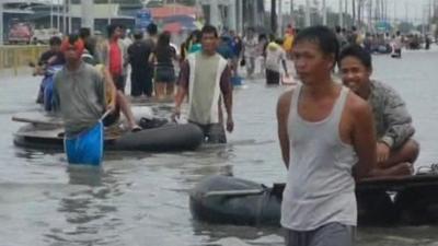 Local residents are finally able to escape heavily-flooded Manila.