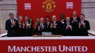 Avram and Joel Glazer and chief executive David Gill opened trading