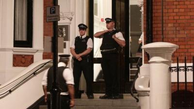 Police officers outside the Ecuadorian Embassy in London