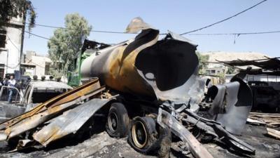 Burnt vehicles are seen after a bomb exploded at a military site near a hotel used by United Nations monitors in Damascus 15 August 15 2012