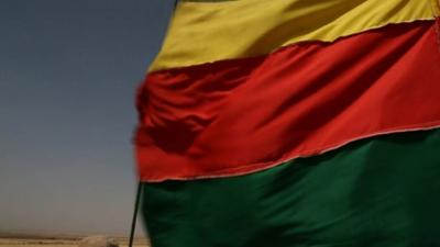 A Kurdish flag flies again in north-eastern Syria