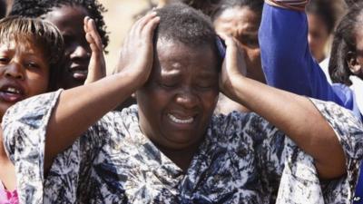 A woman cries as she protests against police near the Lonmin mine in South Africa. Photo: 17 August 2012