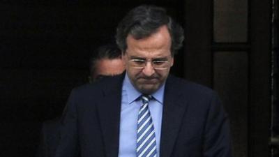 Greek Prime Minister Antonis Samaras leaves talks in Athens' Maximou Mansion on 1 August 2012