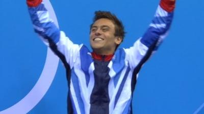 Tom Daley celebrating on the podium