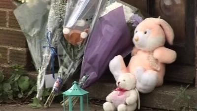 Toys and flowers left at the Cecil family home in Kettering