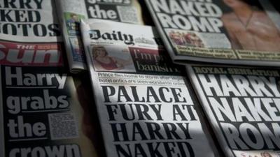 arrangement of newspaper front pages about Prince Harry