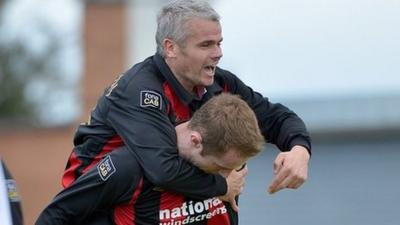 Gary McCutcheon celebrates Timmy Adamson's goal which gave the Crusaders the lead against Lisburn Distillery