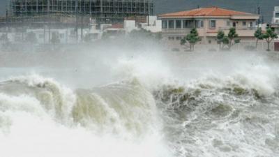 High waves pound the shore in Yonabarucho, Okinawa Prefecture, Japan