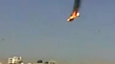 Still from unverified amateur footage, 27/08/12, purporting to show a helicopter in flames after being shot by rebels in the Al Qabun area of Damascus