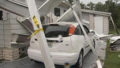 A car damaged by Tropical Storm Isaac