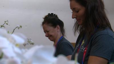 Women work in a flower shop