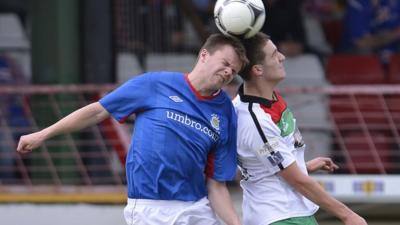 Match action from Glentoran against Linfield