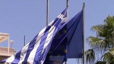 Greek and EU flags