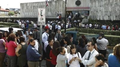 People stand outside court buildings in San Jose after evacuation