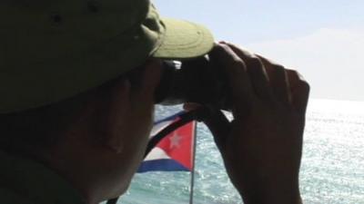 Man looking out over water