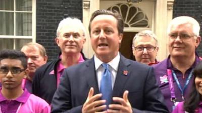 Prime Minister David Cameron with Games Makers outside 10 Downing Street