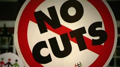 No Cuts protest sign