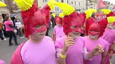 School children taking part in Moving Tides procession